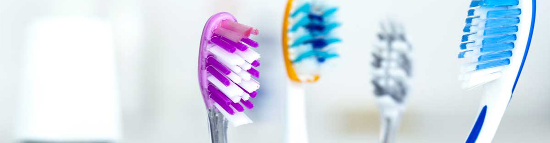 Three tooth brushes.