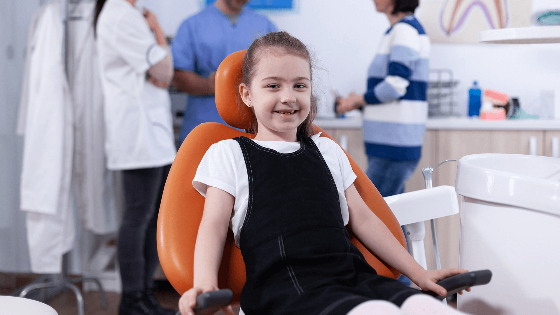 Girl smiling after her checkup.