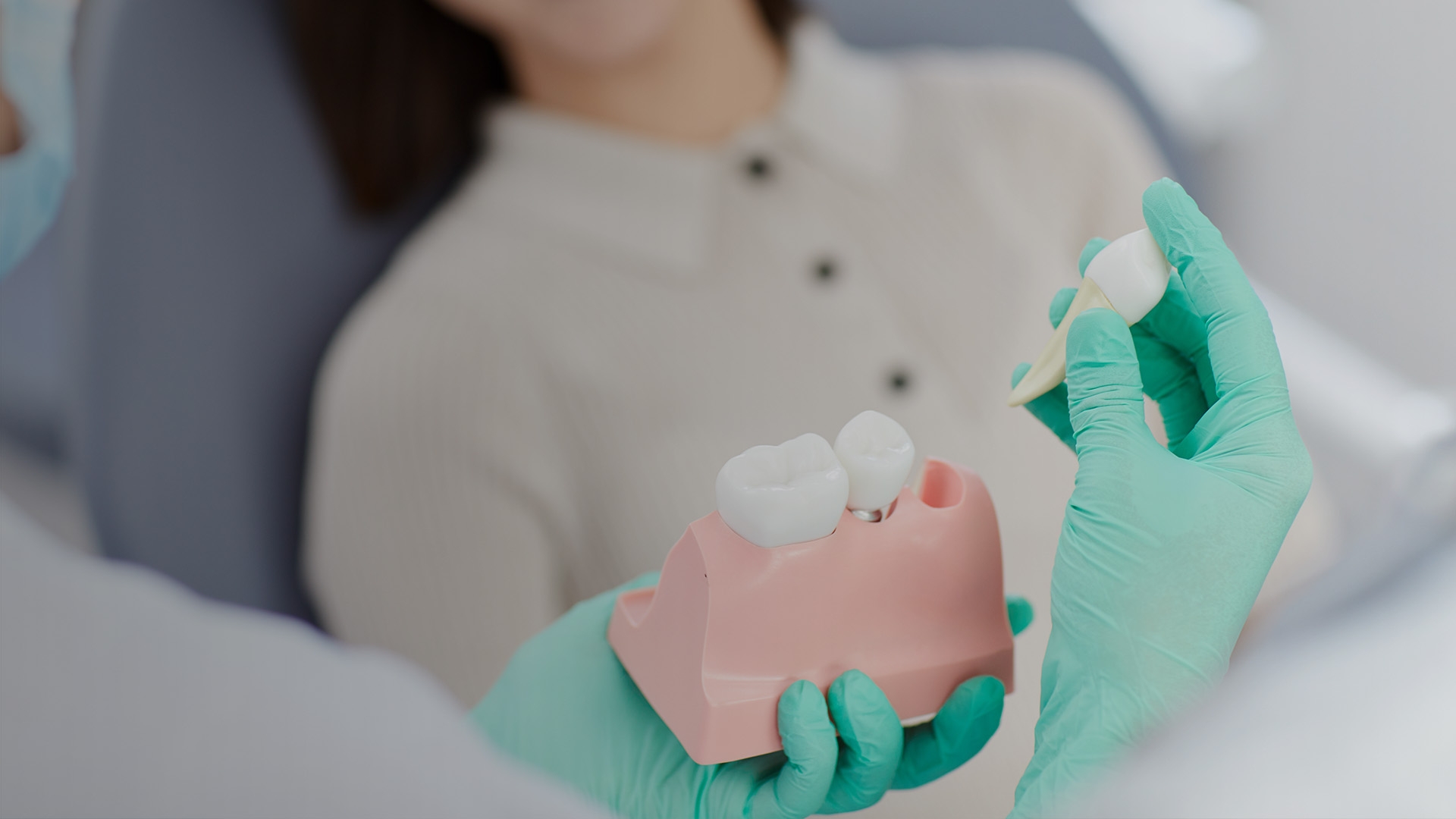 Doctor with tooth out of a client's mouth.