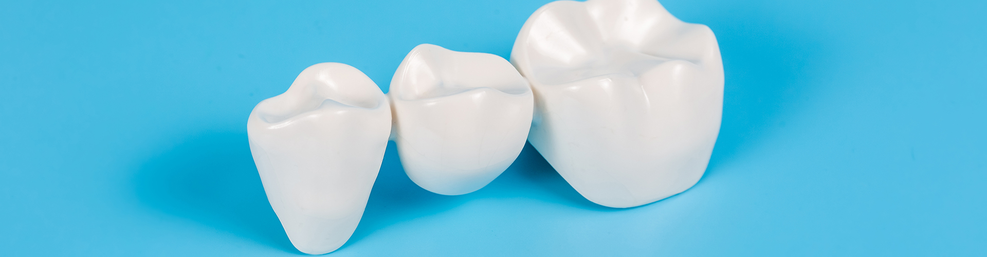 three crowns on a blue surface.