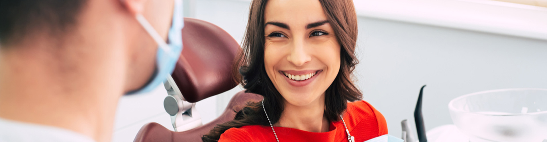 Woman smiling in dentist chair.