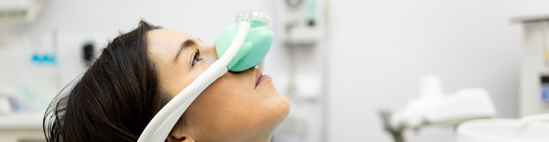 woman with sedation mask over her nose.