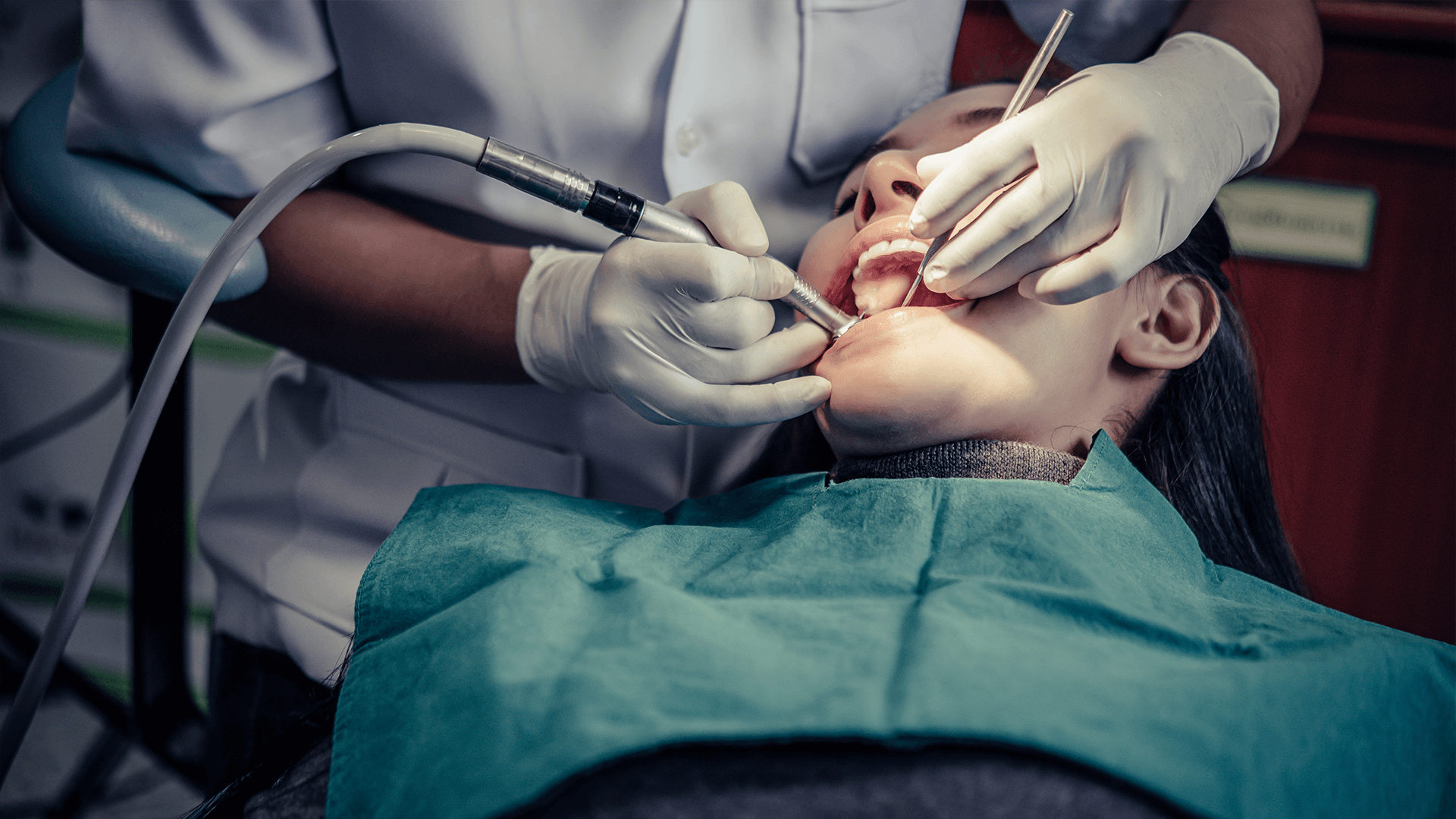 Woman receiving root canal treatment.
